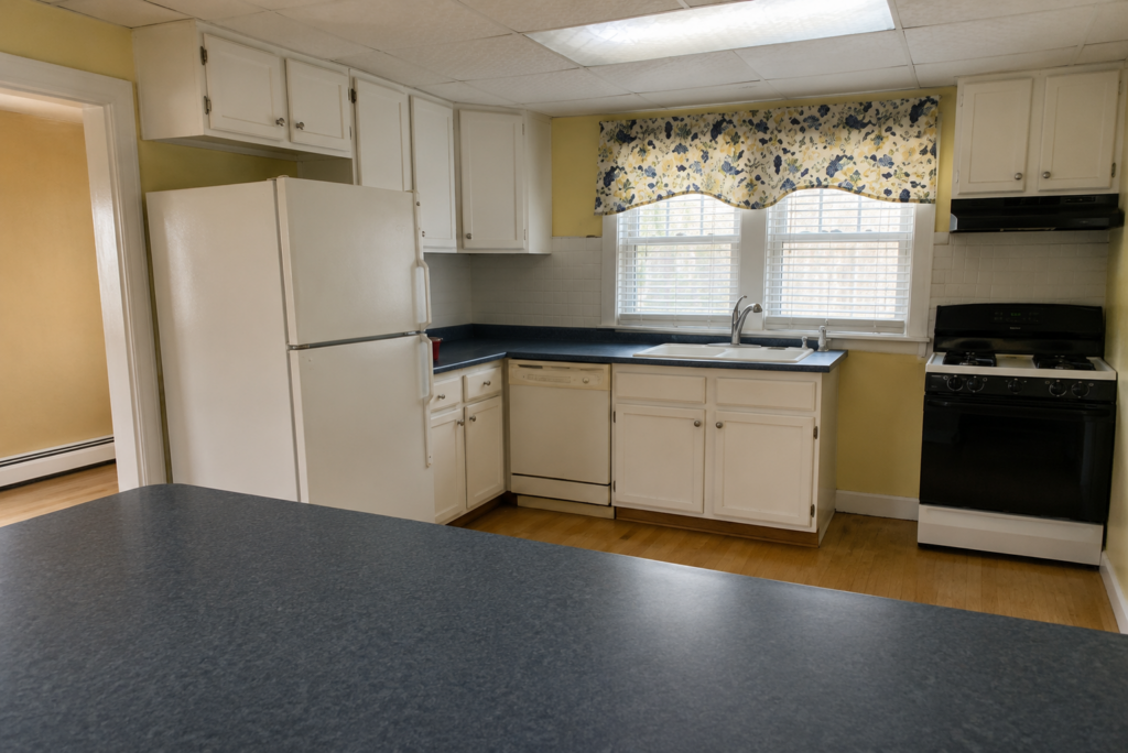 HHistoric Home in Ohio Stunningly Restored to Glory | Florida Room (Before)istoric Home in Ohio Stunningly Restored to Glory | Kitchen (Before)