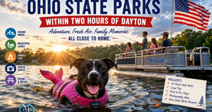 BooBoo the dog wearing a pink mermaid life jacket swimming in an Ohio lake while families fish from a pontoon boat beneath an American flag, representing the best Ohio State Parks within two hours of Dayton.