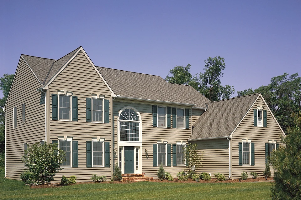 Dayton Ohio Horizontal Vinyl Siding Carolina Beaded™ Horizontal Profile Dayton Ohio Horizontal Vinyl Siding – Carolina Beaded profile on a two-story home with green shutters