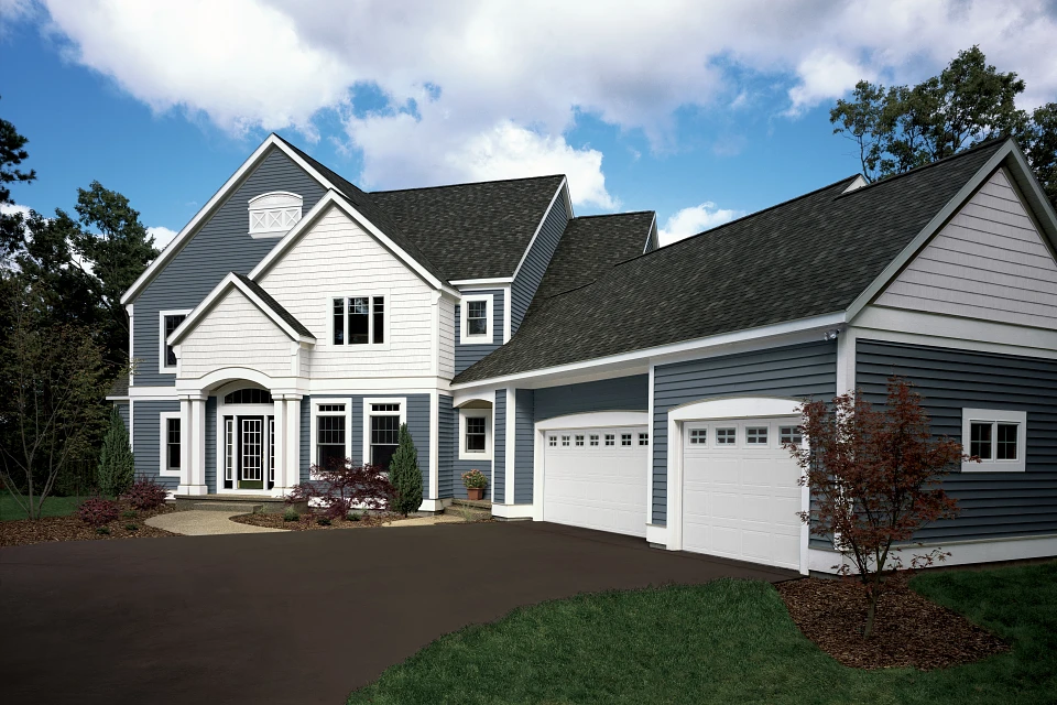 Dayton Ohio Horizontal Vinyl Siding Monogram® Collection Blue & White Exterior Dayton Ohio Horizontal Vinyl Siding – Monogram collection on a two-story home with blue and white accents