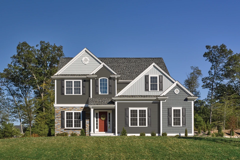 Dayton Ohio Horizontal Vinyl Siding Restoration Classic™ Traditional Exterior Dayton Ohio Horizontal Vinyl Siding – Restoration Classic siding on a gray two-story home with stone accents
