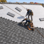Roofing crew installing architectural asphalt shingles over synthetic underlayment on a Dayton, Ohio home.
