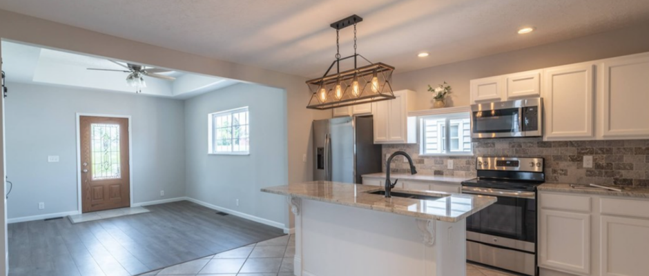 1893 historic home kitchen renovation featuring restored craftsmanship, modern farmhouse design, custom cabinetry, stone countertops, stainless appliances, and bright open-concept living restored by Thrush & Son® Roofing & Exterior Solutions in Brookville Ohio.