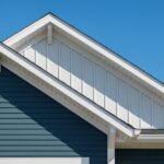 Fascia replacement Dayton Ohio home exterior showing clean white fascia and soffit along gable roofline under a clear blue sky.