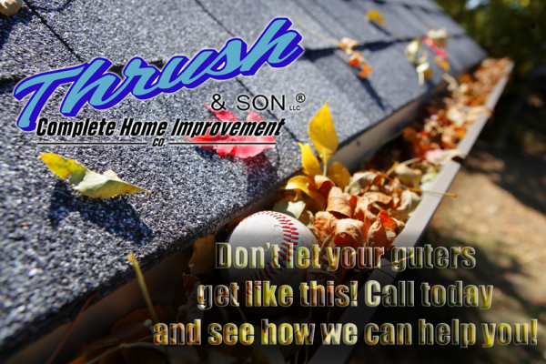 Clogged roof gutter filled with fall leaves and debris showing why homeowners should maintain gutters and contact Thrush & Son for gutter solutions.