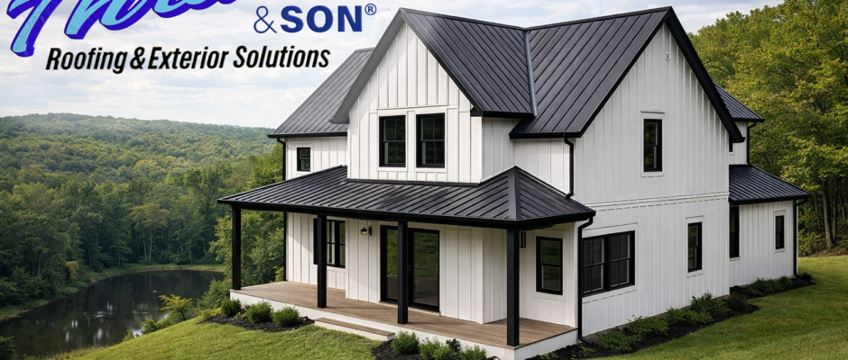 Modern farmhouse with white steel siding in a board-and-batten design, black metal roof, black window trim, and black gutters overlooking wooded landscape and pond.