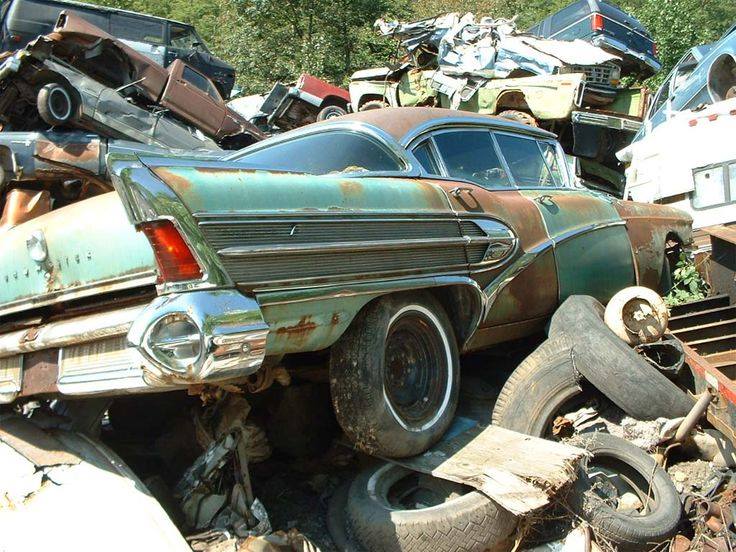 Rusting classic car in a junkyard showing long-term material failure, illustrating why the benefits of vinyl siding include durability, low maintenance, and resistance to weather damage