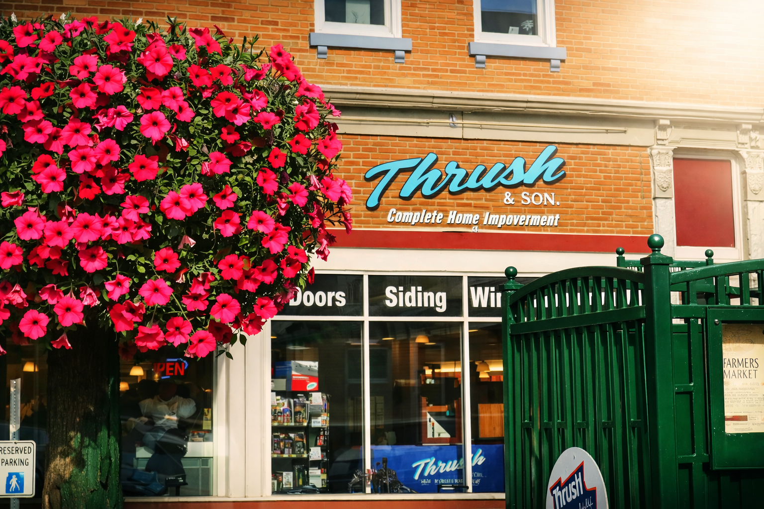 Thrush & Son storefront in downtown Troy Ohio with vibrant flowers highlighting 57 years of trusted family-owned home improvement service