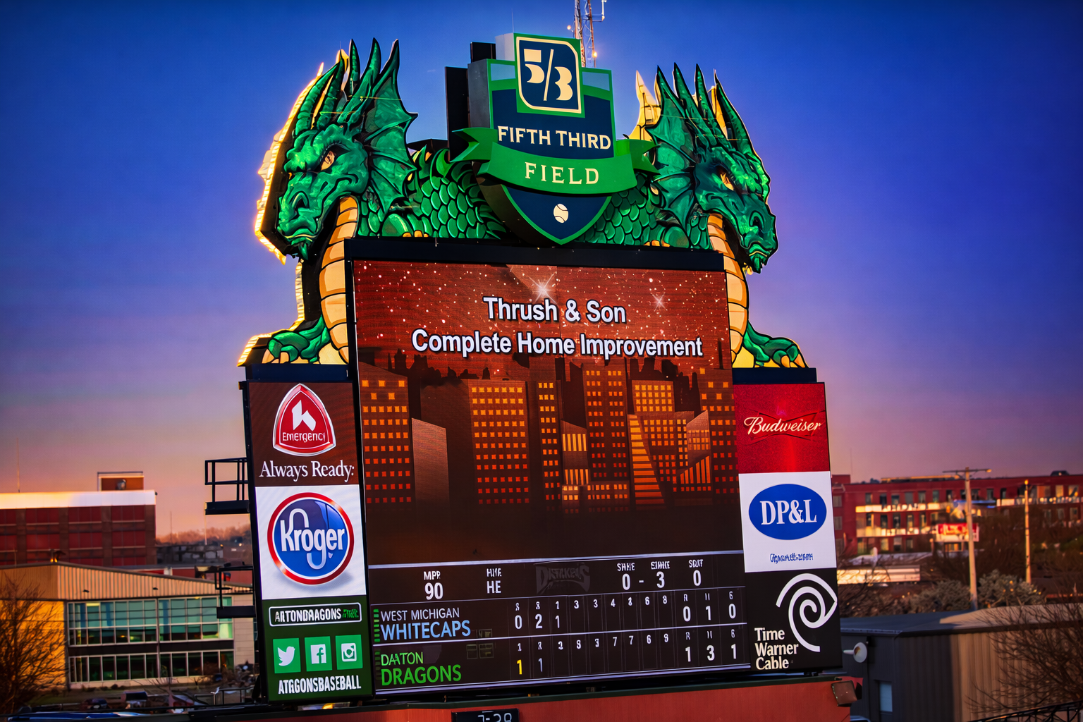 Thrush & Son sponsorship displayed on the Fifth Third Field scoreboard during a Dayton Dragons Minor League Baseball game