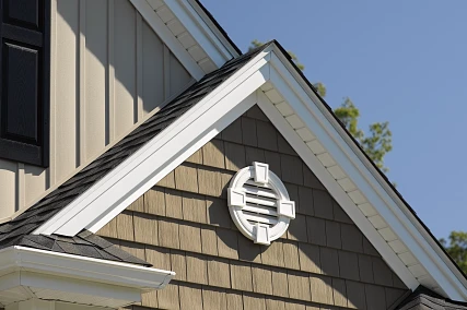 Triple 3-⅓” Invisivent® soffit ventilation system installed on a gable, providing high airflow for proper attic ventilation in limited overhang conditions