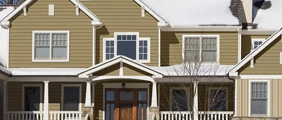 Home exterior with vertical vinyl siding designed for durability in changing weather conditions.
