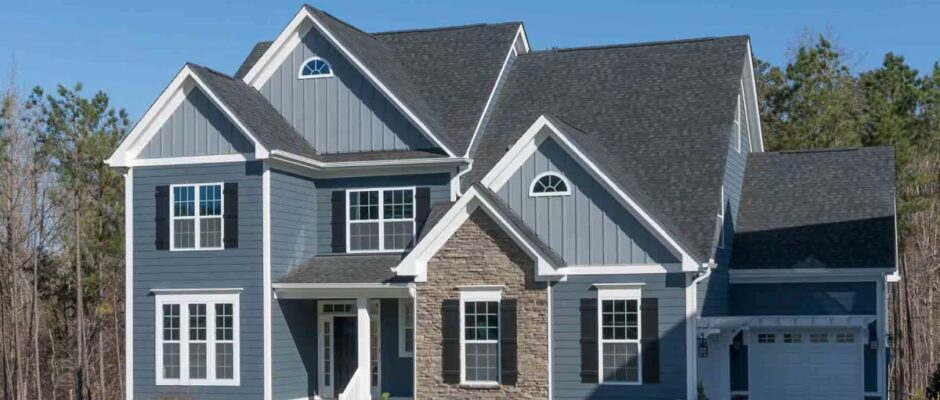 Home exterior featuring vertical vinyl siding with clean lines and modern architectural detail.