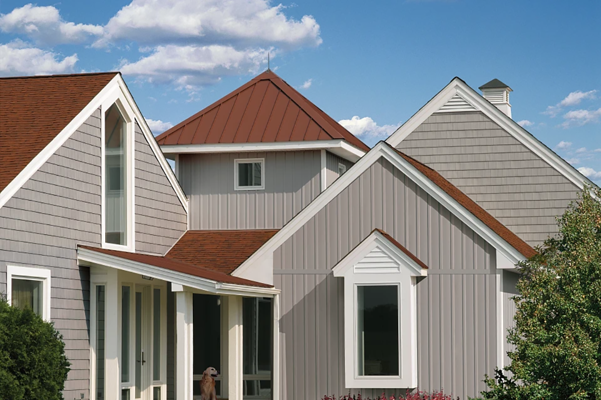 Residential home featuring vertical vinyl siding with board and batten style exterior design.