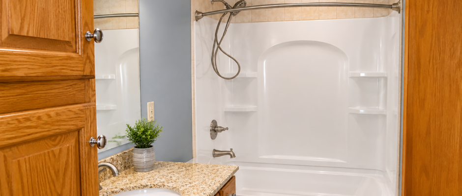 Warm Granite Vanity and Tub Surround Bathroom Remodel - Thrush & Son®