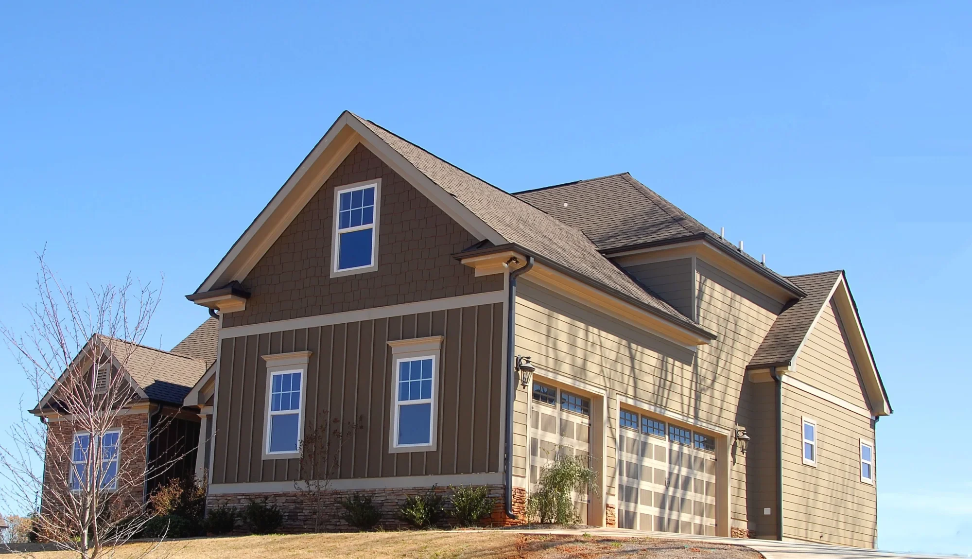 Board and Batten Siding: modern two-story home in Miami Valley with beautiful board and batten siding, enhancing curb appeal and durability – Thrush & Son® exterior solutions