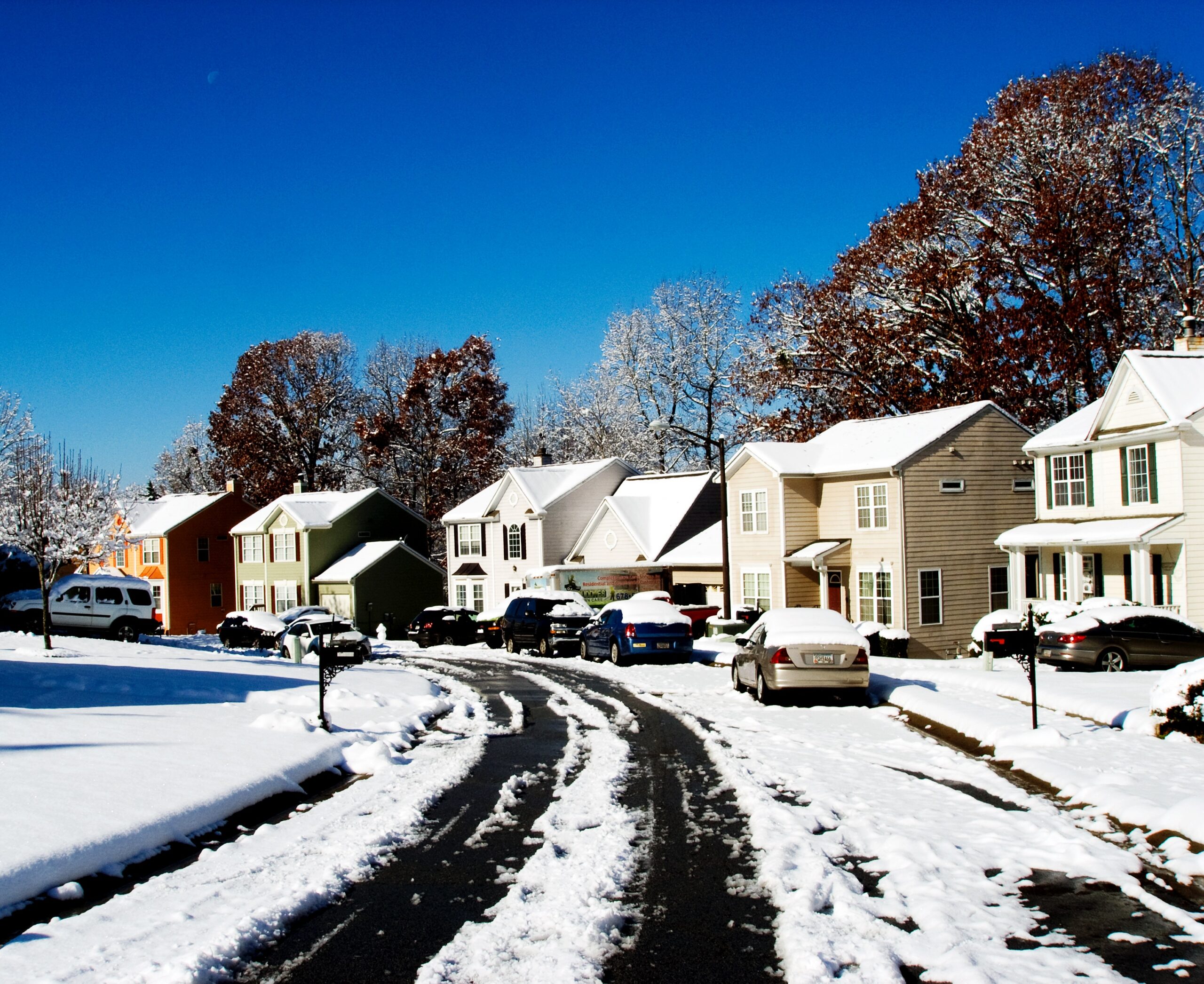 Is Your Home Ready for a Brutal Winter In 2026 and Beyond? Snow-covered neighborhood showing homes facing extreme winter conditions
